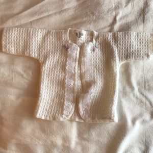 Baby sweater with lace